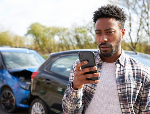 Young,Man,Standing,By,Damaged,Car,After,Traffic,Accident,Calling